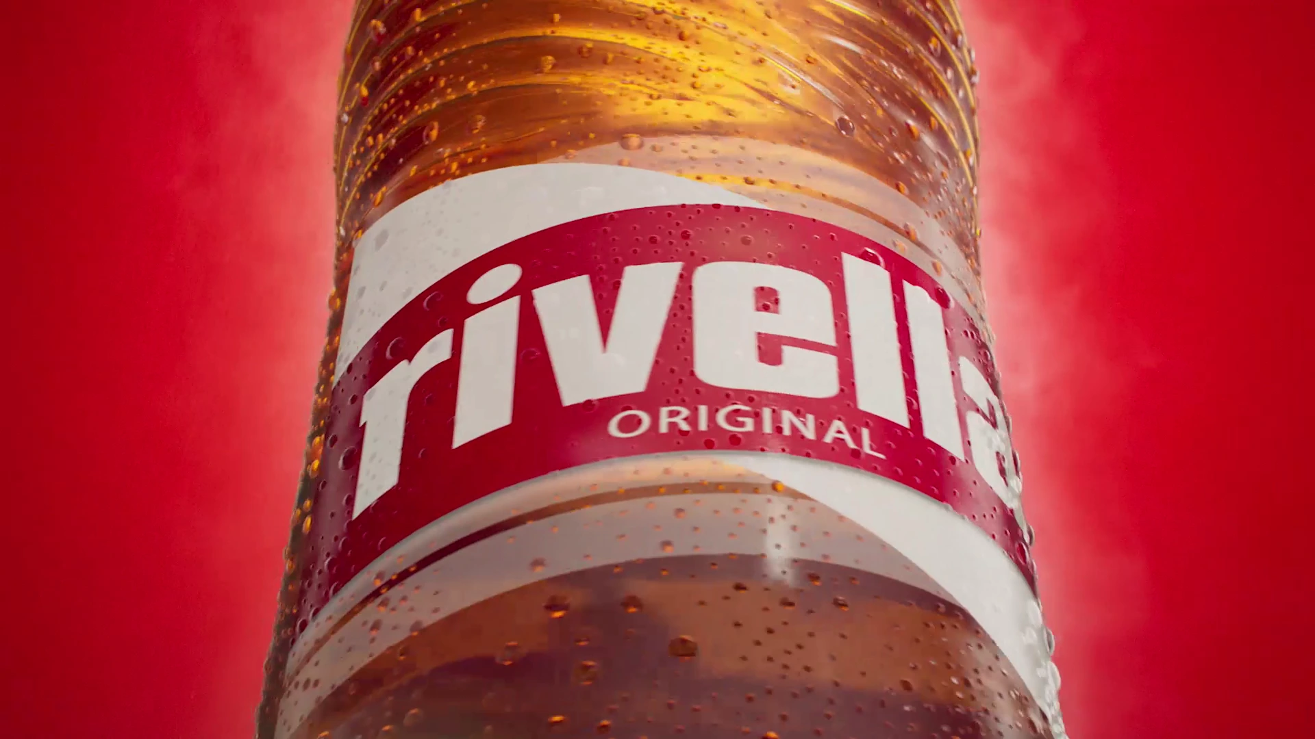 Corresponding finished Rivella Original label close-up from the downstream production, with a similar low camera angle