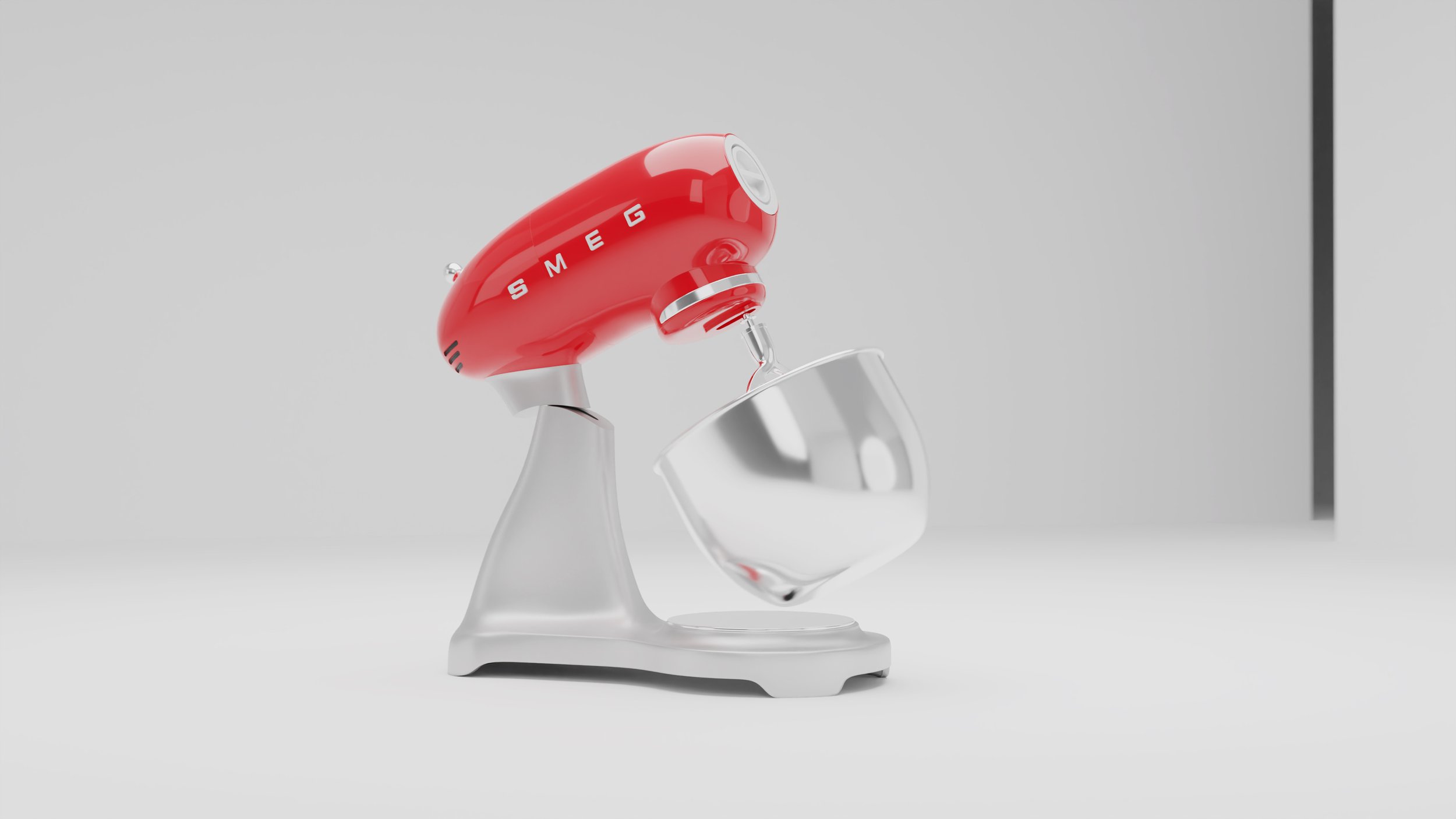 Red SMEG mixer with its head lifted above the glass bowl